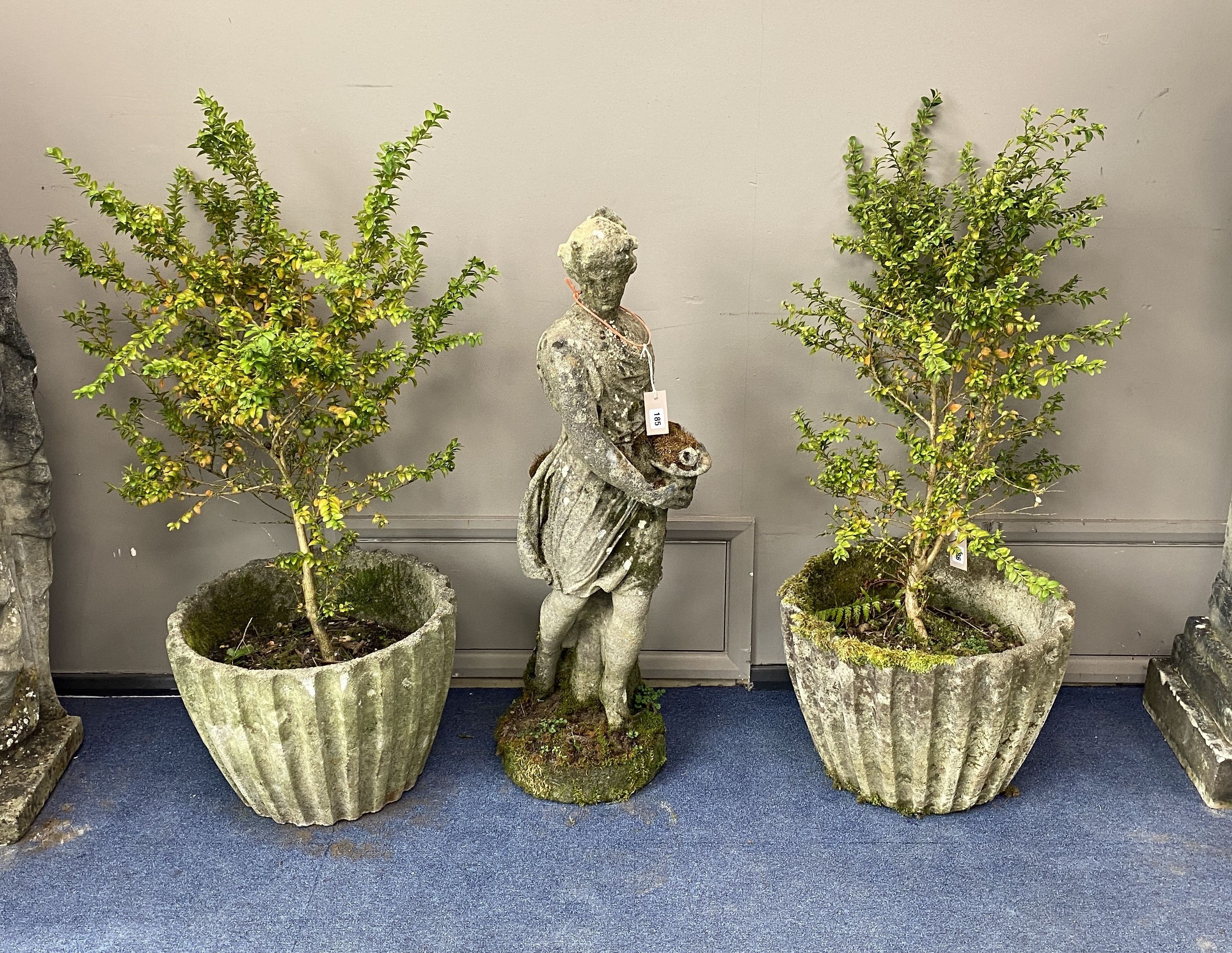 A pair of reconstituted stone circular garden tubs, diameter 50cm